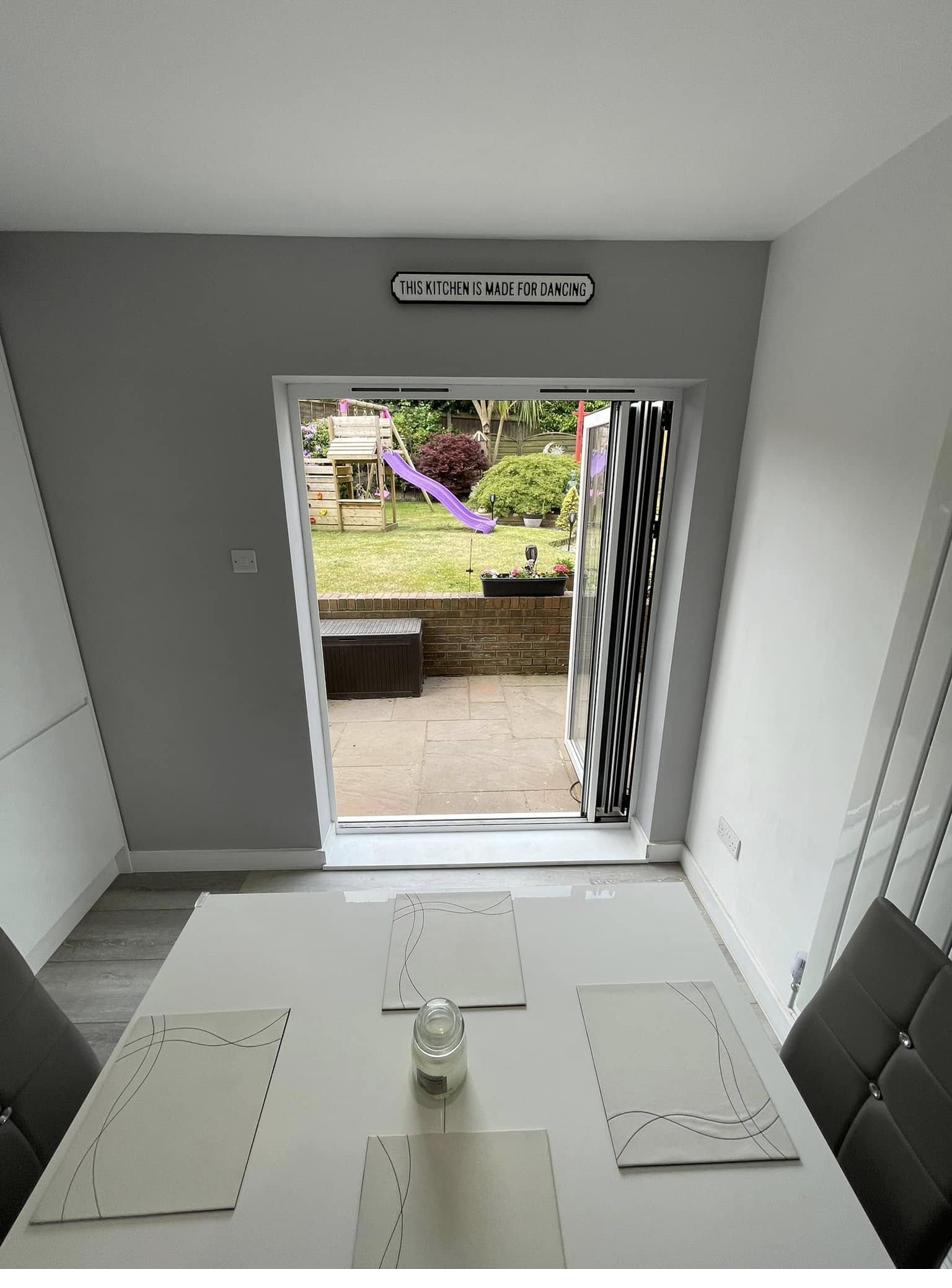Dining area with bifold doors to garden installed by RyBuild
